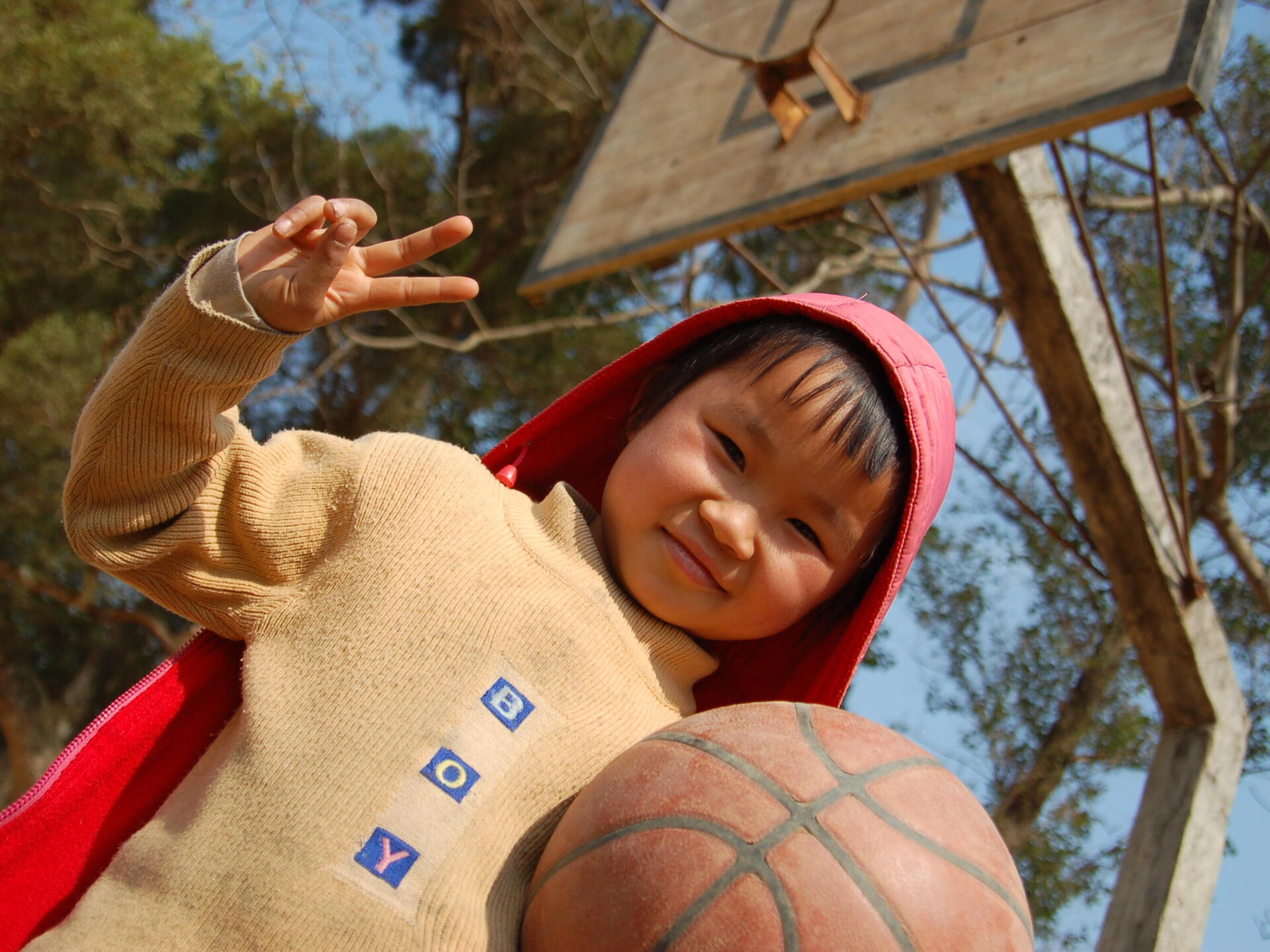 Picture of a child holding a basketball