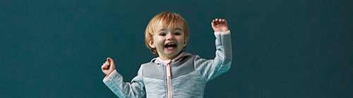 Image of child with arms up
