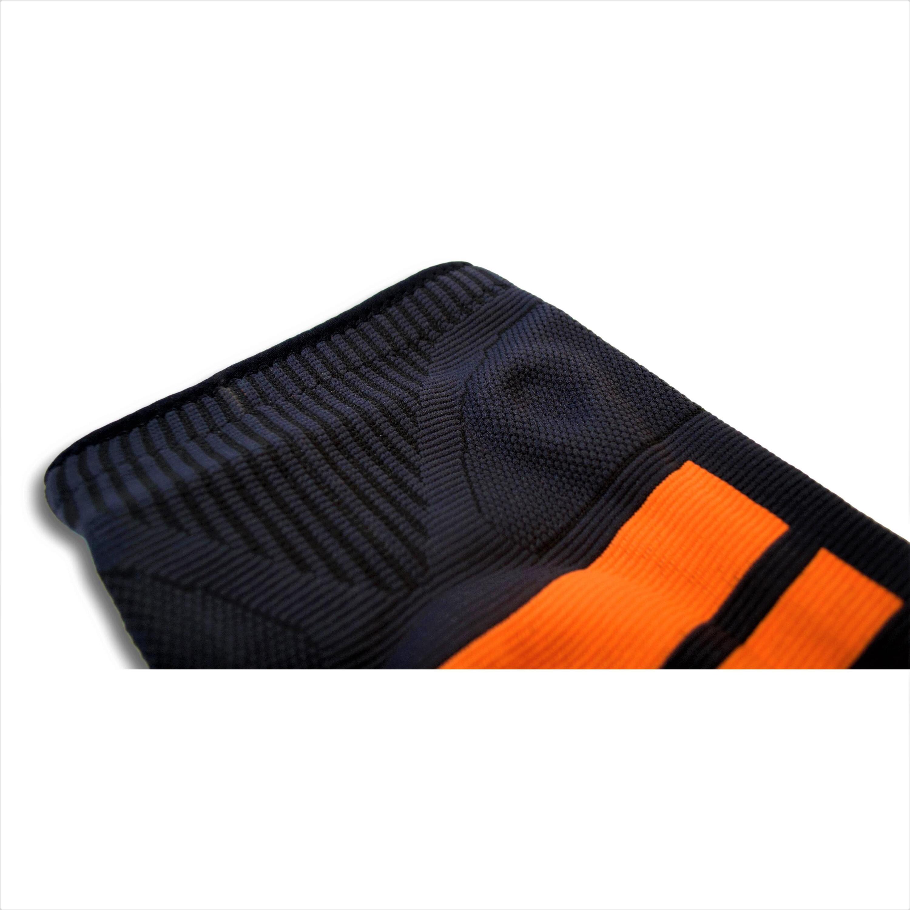 Rodillera Elástica con Disco de Gel INDIGO Talle  L Negro-Naranja 3/4