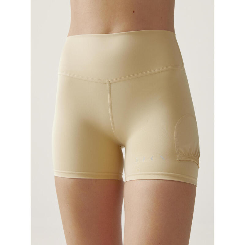 Short de sport pour femme en tissu performant avec poche à balles