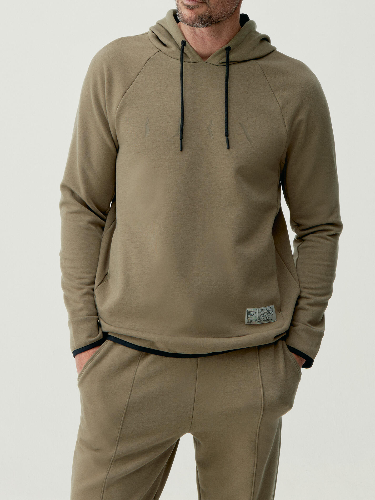 BORN LIVING YOGA Sudadera de hombre Born Living Yoga en tejido performance con bolsillo Roe