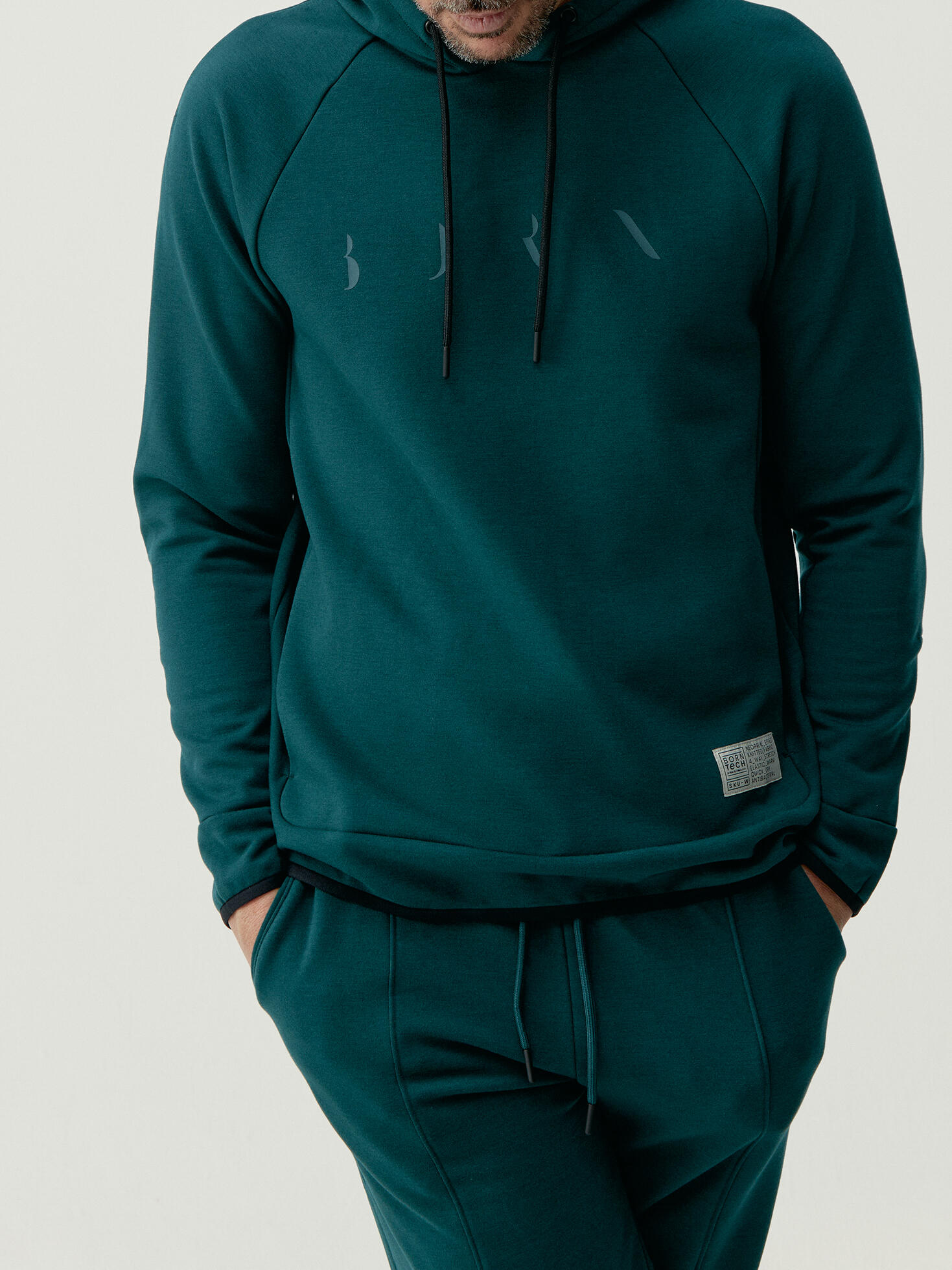 BORN LIVING YOGA Sudadera de hombre Born Living Yoga en tejido performance con bolsillo Roe