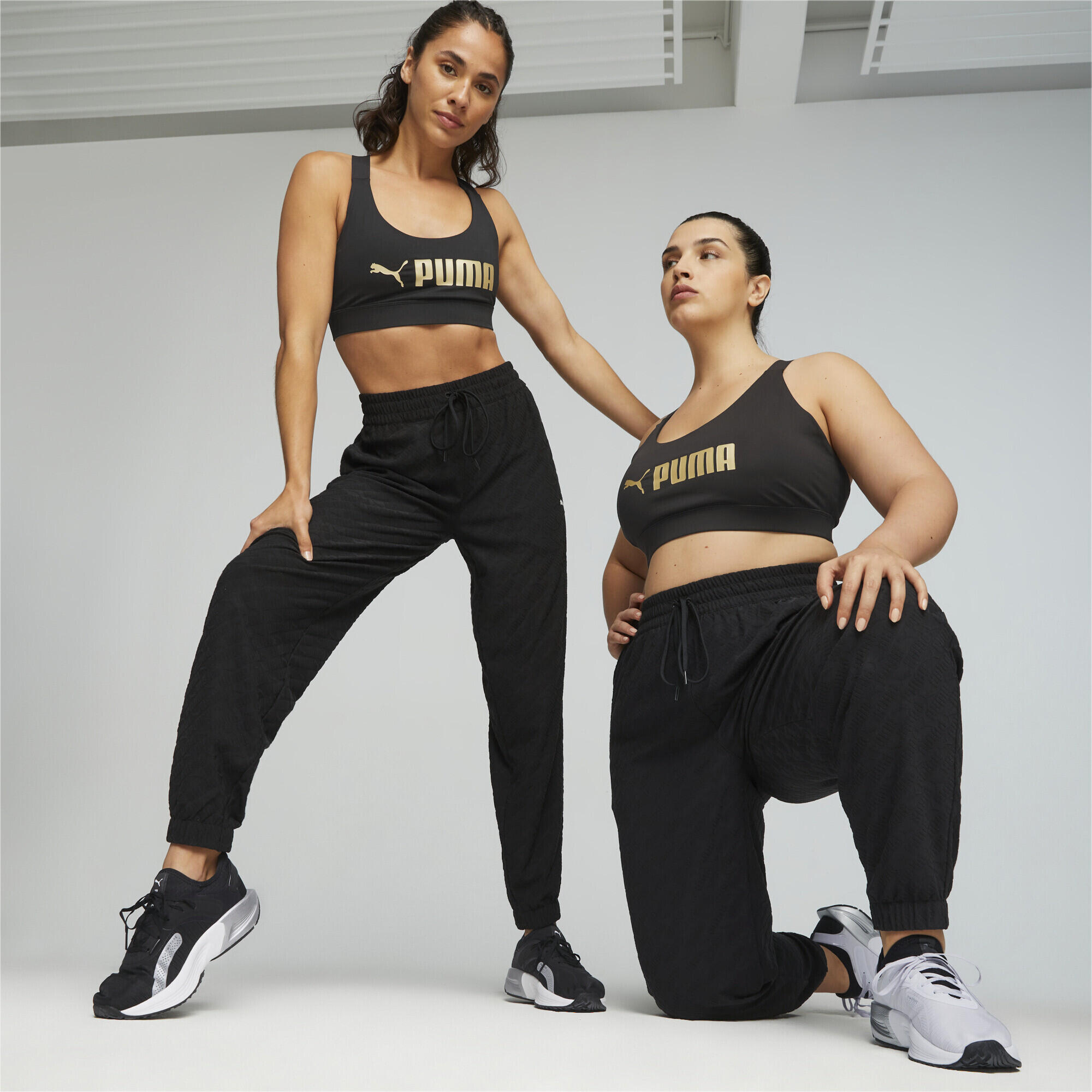 PUMA Fit Mid Support Trainings-BH Damen PUMA Black Gold 2/6