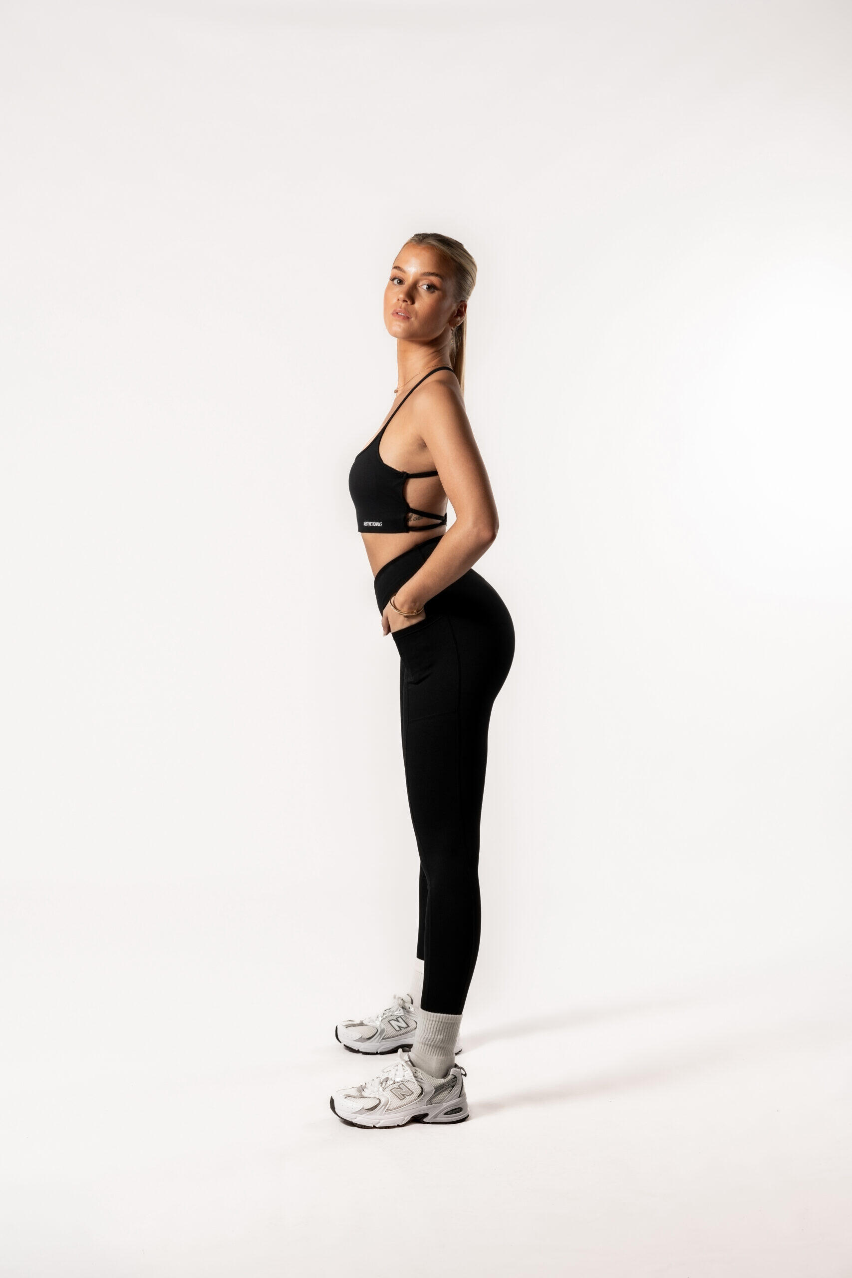 Damen Leggings mit gekreuztem Bund und Taschen für Fitness schwarz 4/5