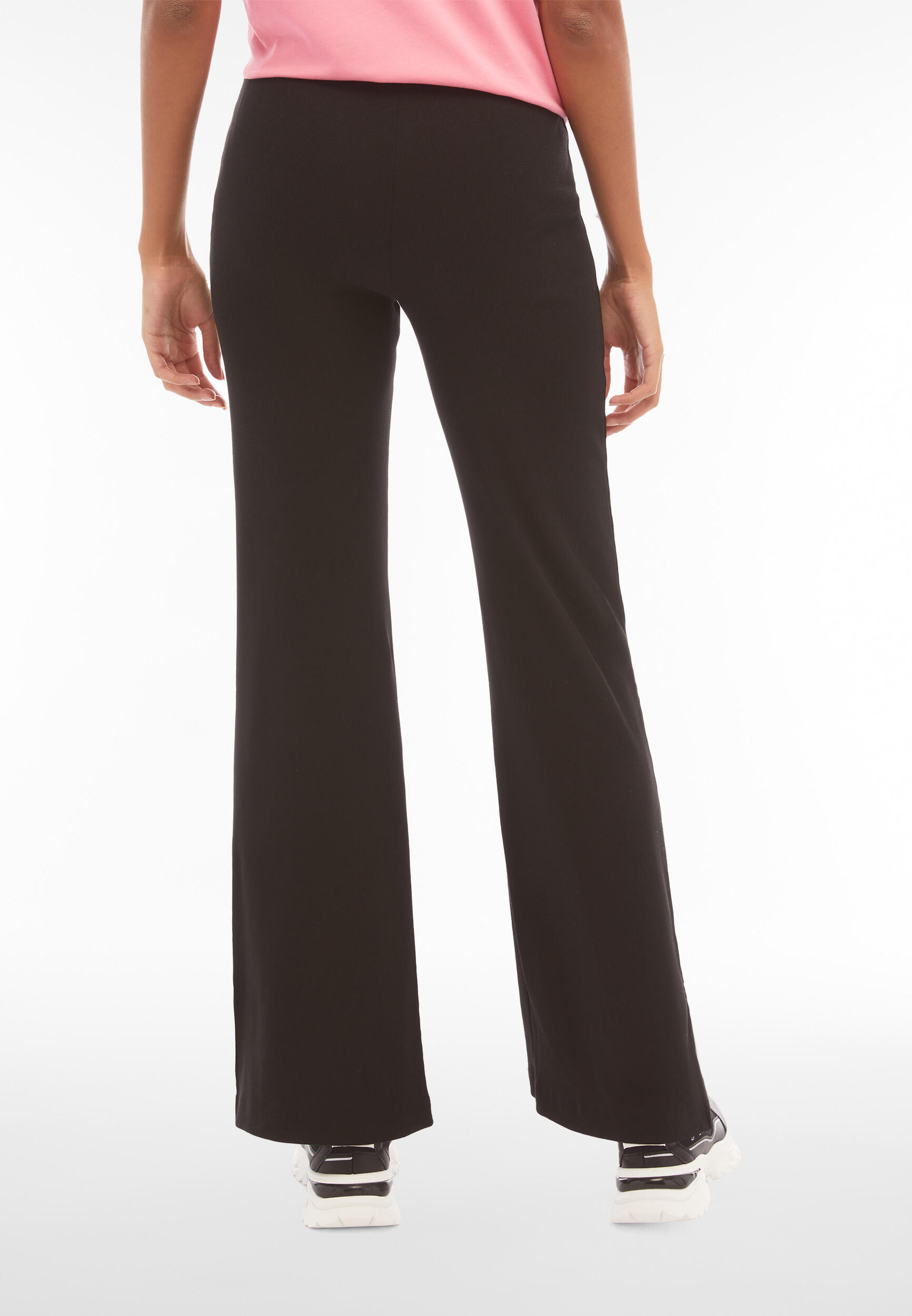 Pantaloni in costina dal fondo flare con spacchi laterali 4/5