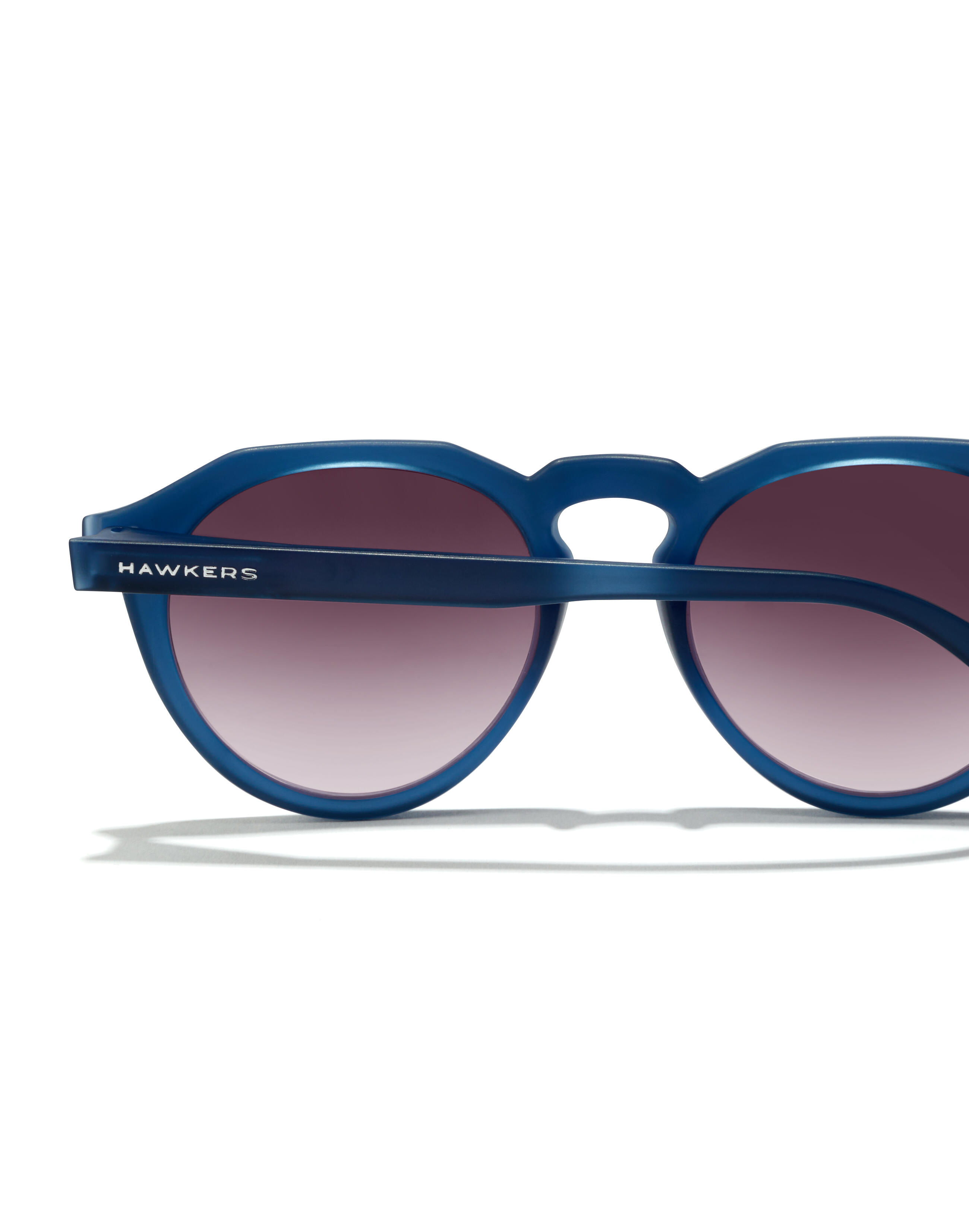 HAWKERS Zonnebrillen mannen en vrouwen NAVY TRANSPARENT IRON WARWICK RAW 4/8