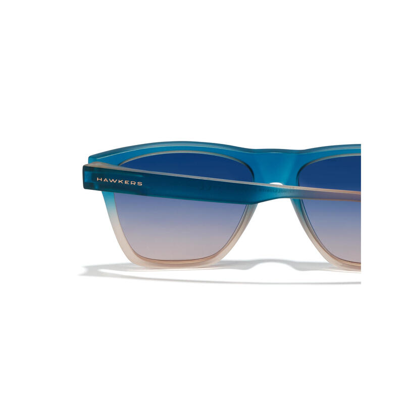 HAWKERS - Lunettes de soleil pour Homme et Femme Sunrise Bleu à Peach - ONE LS