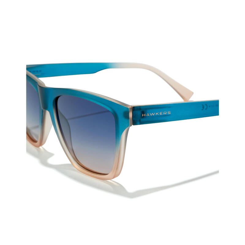 HAWKERS - Lunettes de soleil pour Homme et Femme Sunrise Bleu à Peach - ONE LS