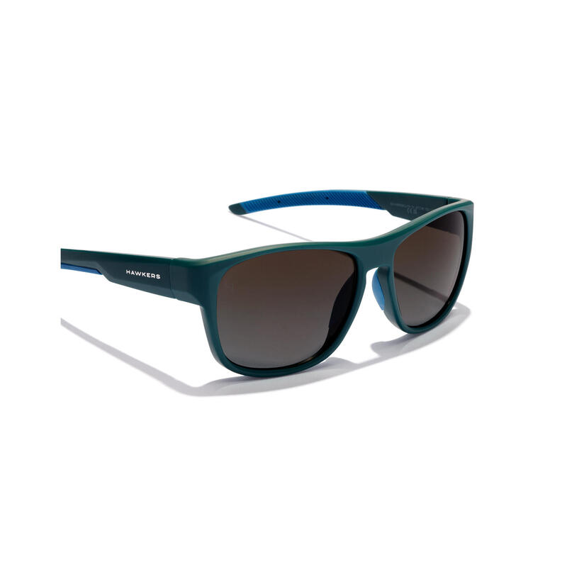 HAWKERS - Lunettes de soleil pour Homme et Femme tempête sarcelle noire - GRIP
