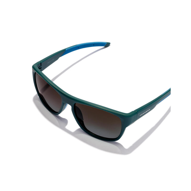 HAWKERS - Lunettes de soleil pour Homme et Femme tempête sarcelle noire - GRIP