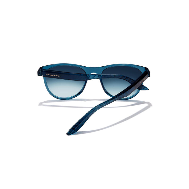HAWKERS - Gafas de Sol para Hombre y Mujer NAVY BLUE INDIGO - TRAIL