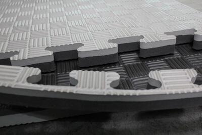 Puzzelmat 100 x 100 x 2,5 cm grijs/zwart - set van 4