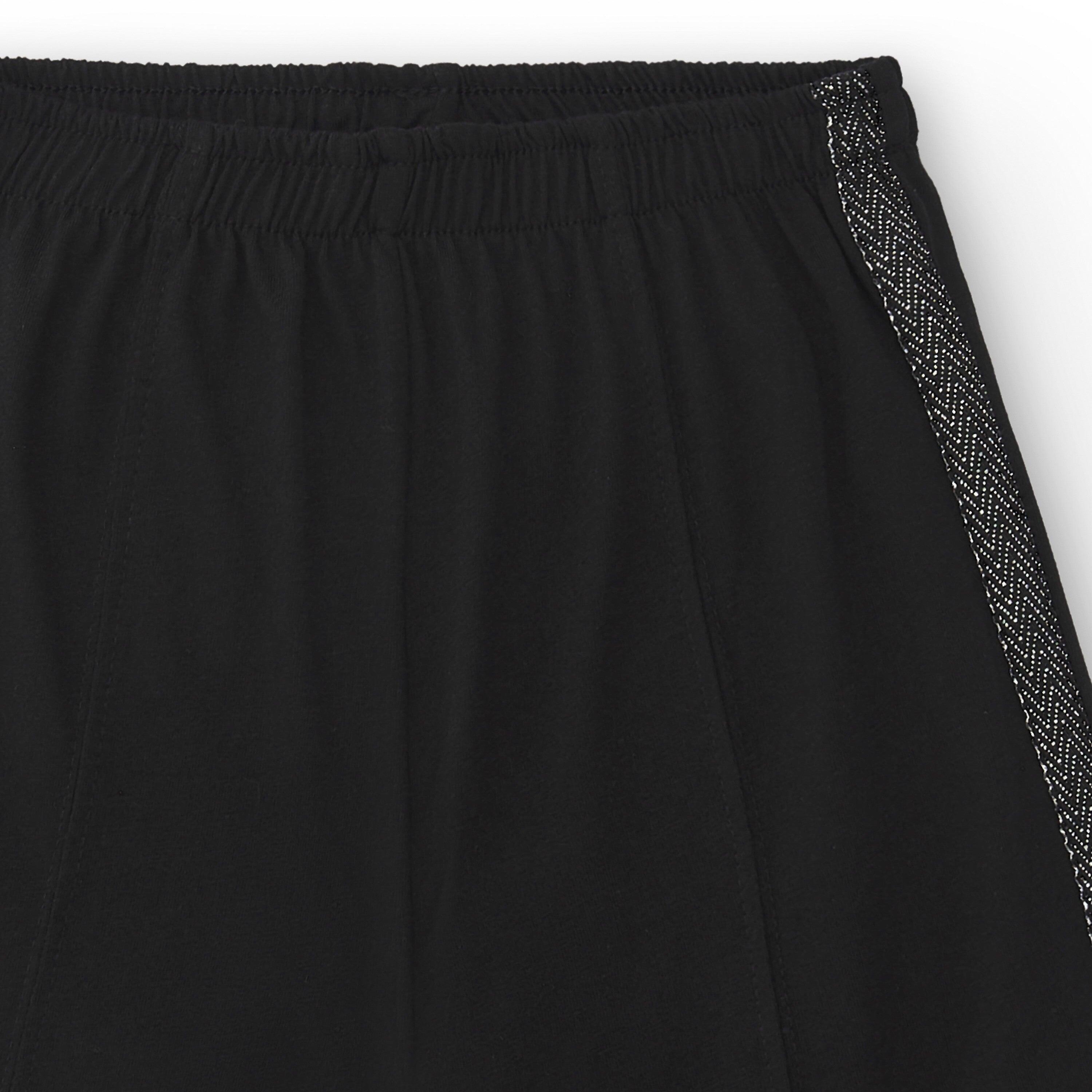 Calças pretas largas para meninas com detalhe 5/5