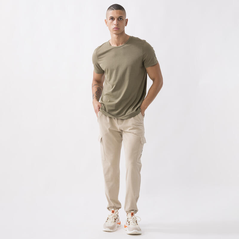 T-SHIRT DYNAMISCHE WERELD IN JERSEY MILITARY GREEN KATOEN