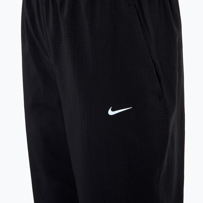 Dámské běžecké kalhoty Dri-Fit Fast Mid-Rise 7/8
