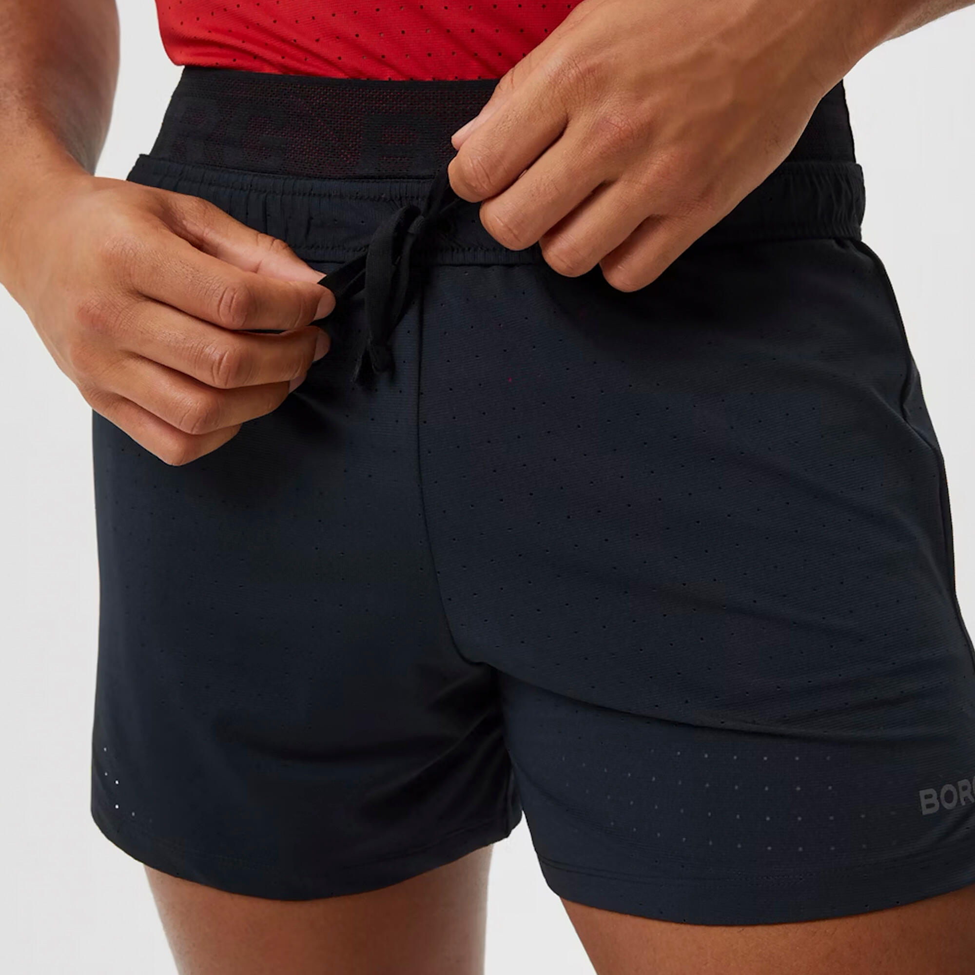 Atmungsaktive perforierte Sportshorts für Herren 3/6