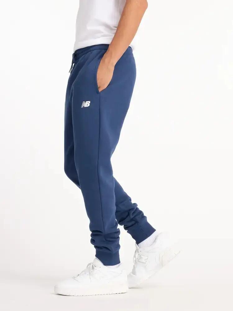 Spodnie dresowe męskie NEW BALANCE bawełna ciepłe 3/7
