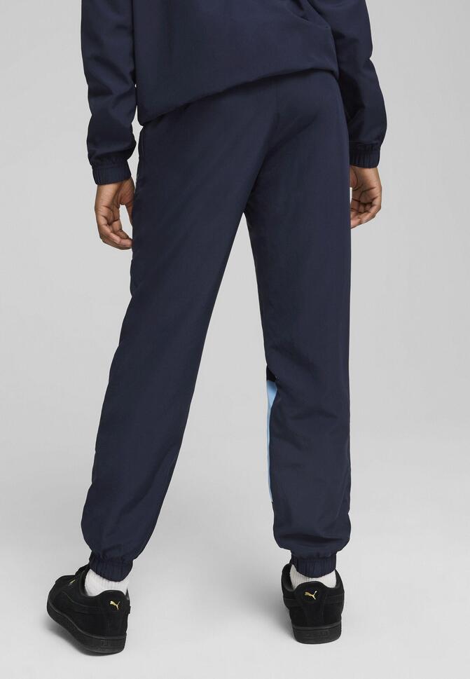 Młodzieżowe spodnie Manchester City ftblARCHIVE PUMA Navy Team Light Blue