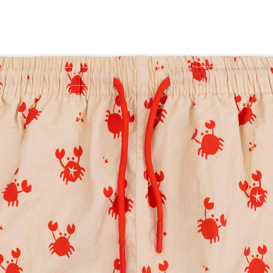 Swim Essentials | Bañador short UV beige/rojo con estampado de cangrejo niños 2/5