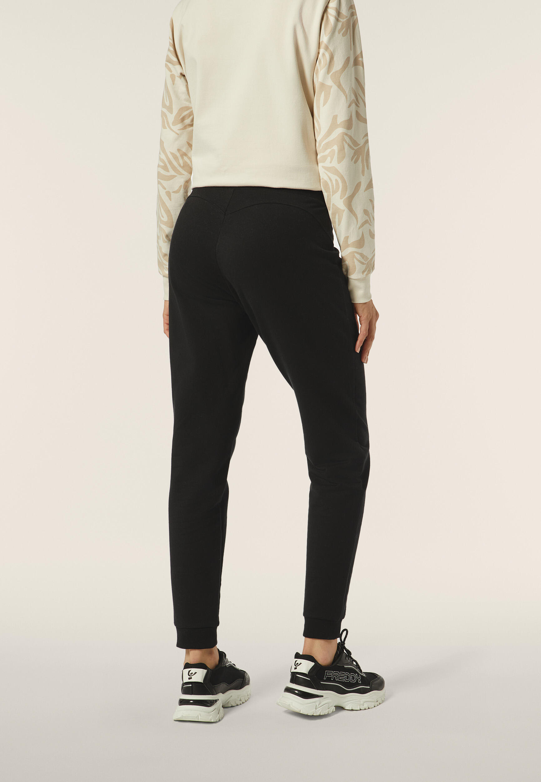 Pantaloni donna in felpa garzata con fondo a polsino 3/5