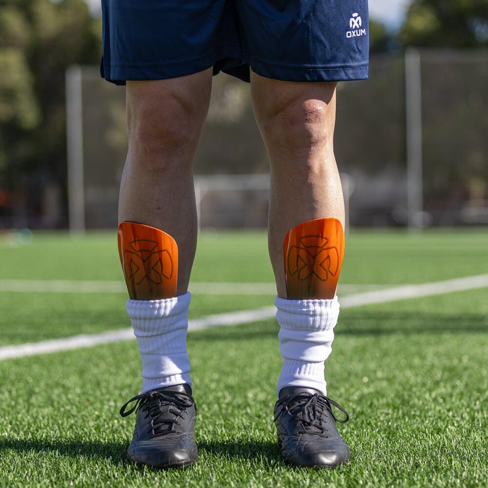 Parastinchi da calcio One Kosmos arancione S 5/6