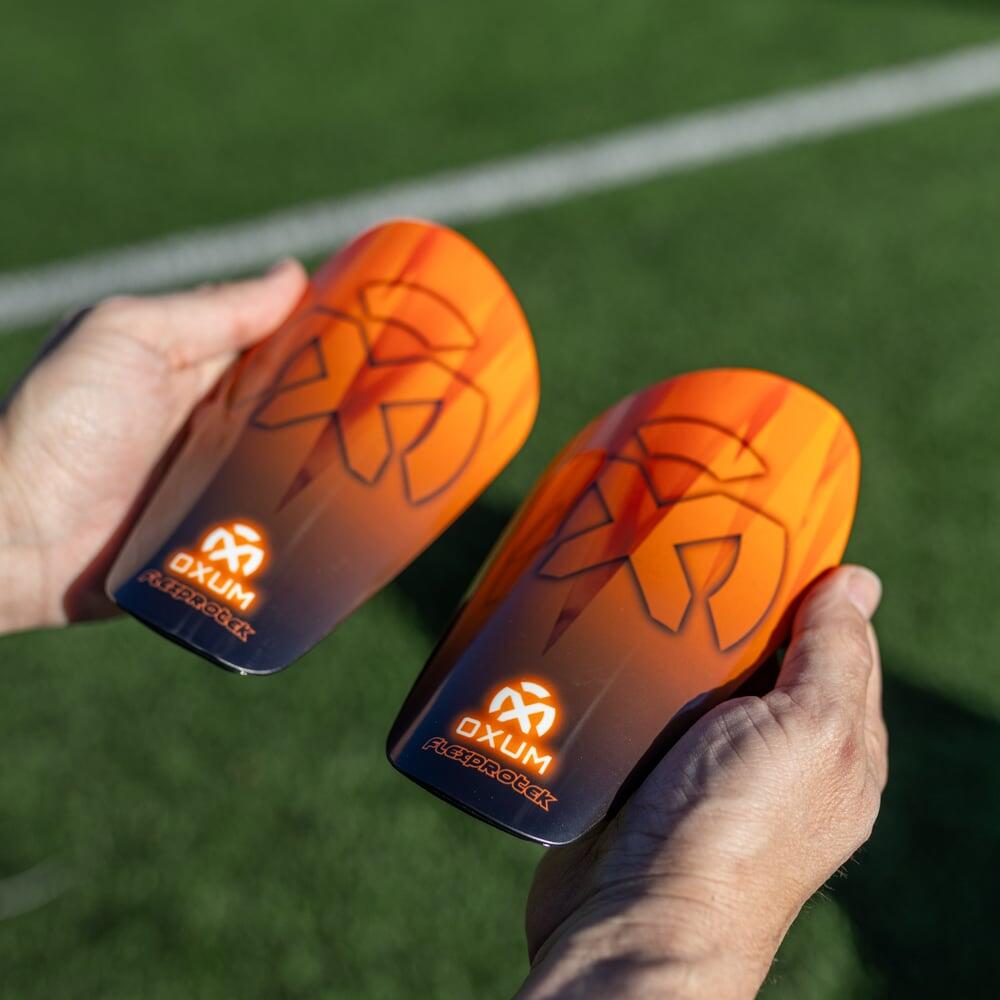 Parastinchi da calcio One Kosmos arancione S 6/6