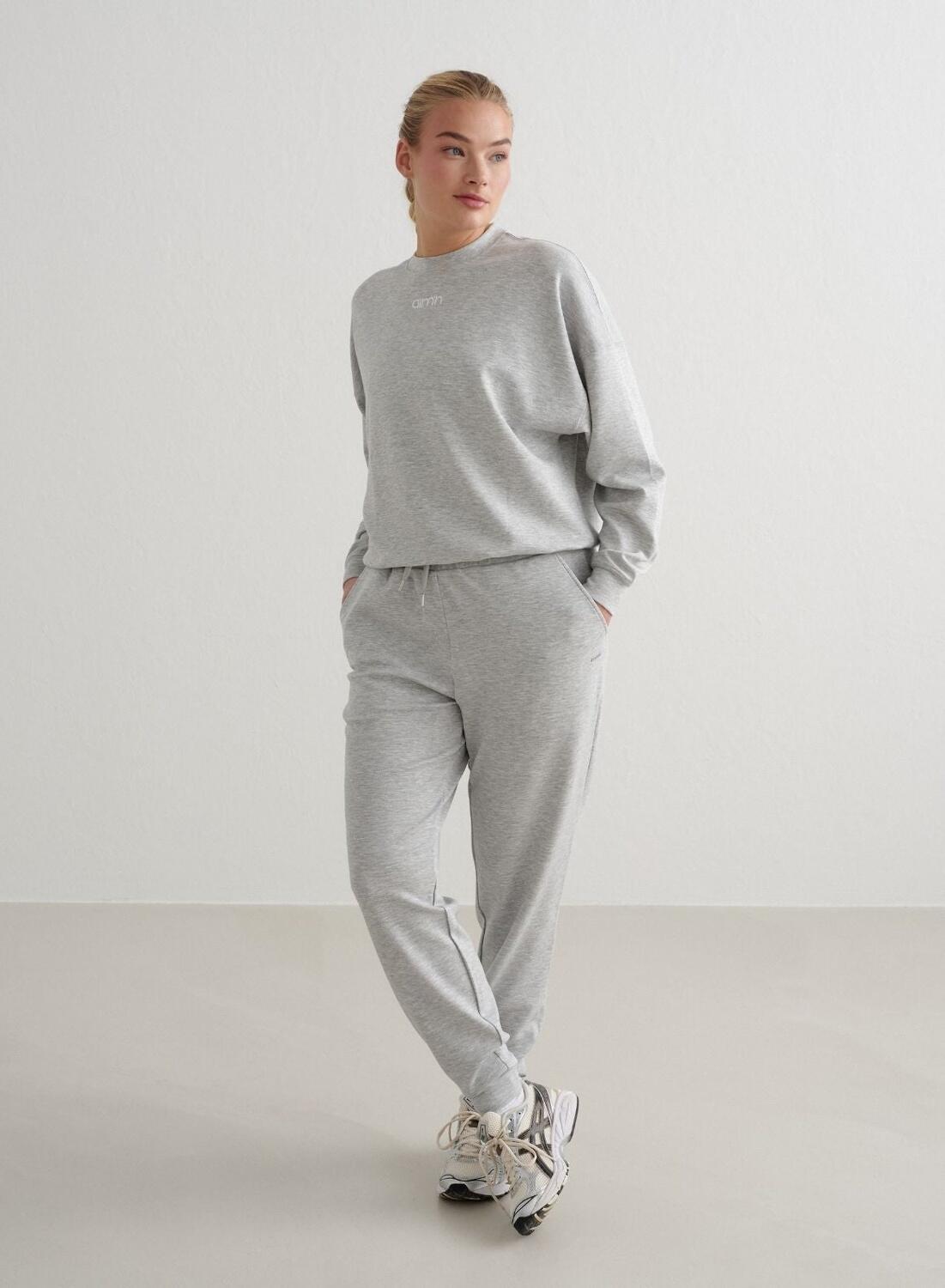 Damskie spodnie dresowe regular fit, ściągacze Comfy Modal jasnoszary melanż 3/4