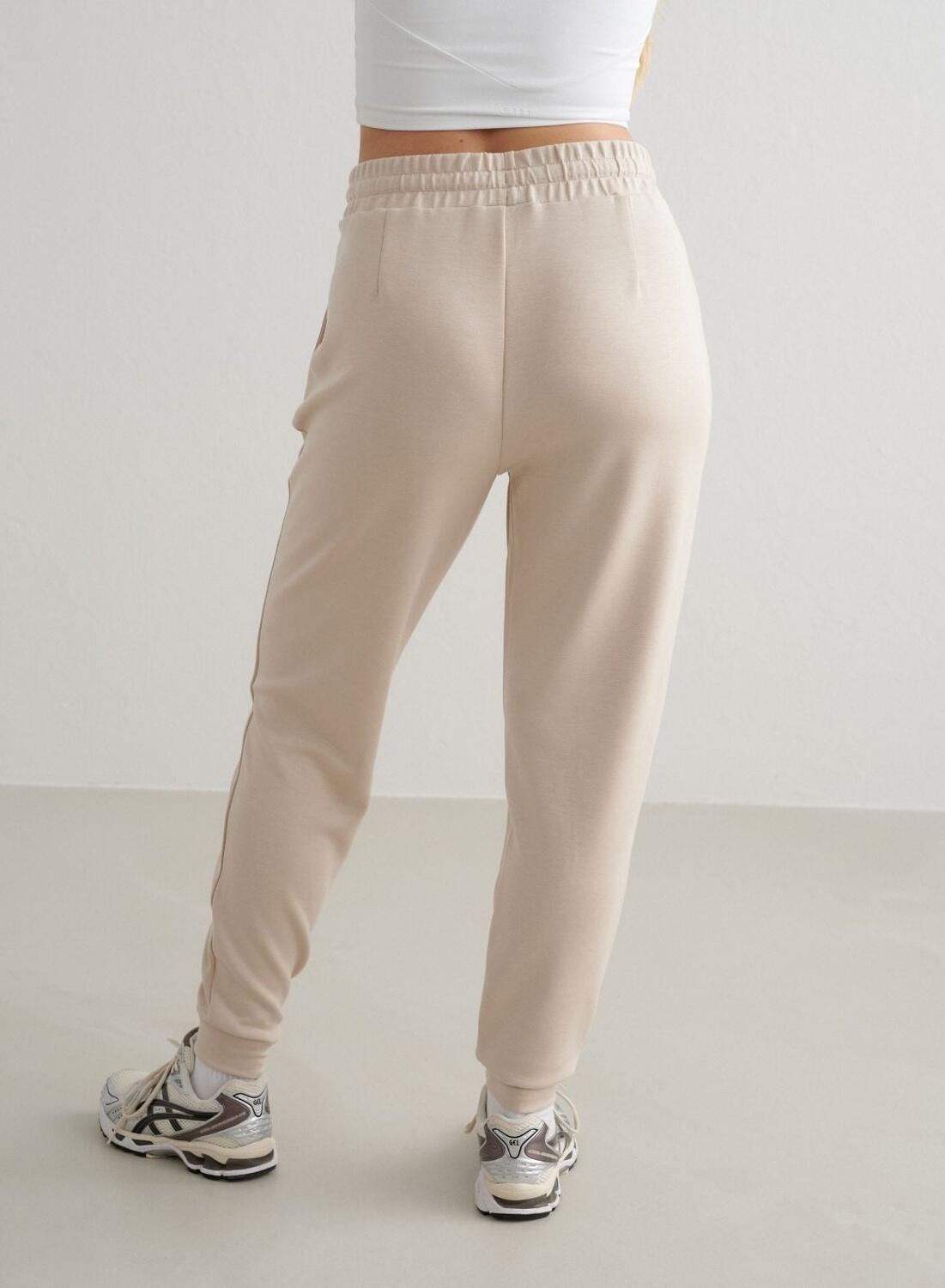 Donna Pantaloni della tuta Traspiranti Crema 3/4