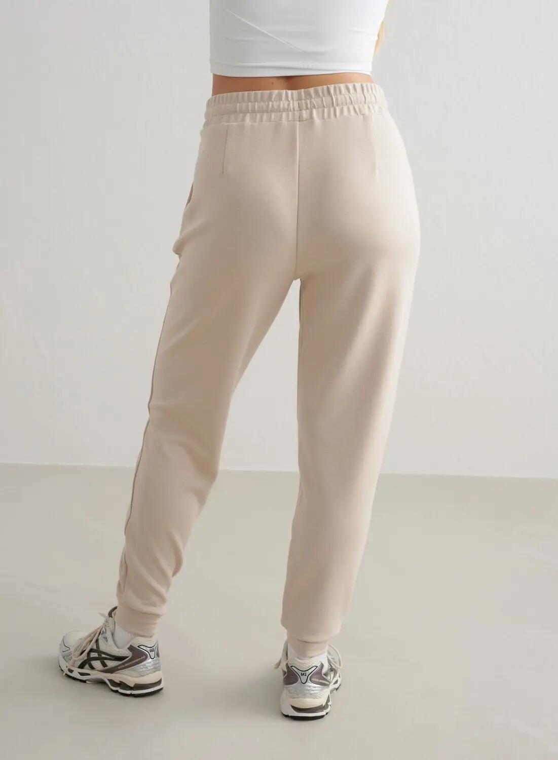 Damskie spodnie dresowe regular fit, ściągacze Comfy Modal beżowe 3/4