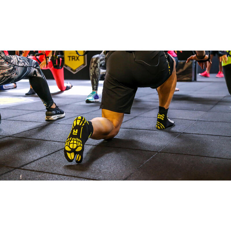 Chaussette araignée noire et jaune pour l'antigravité et le power yoga.