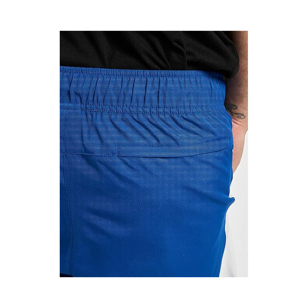 Pantalon de survêtement New Balance NB ATHLETICS WINDBREAKE 6/7