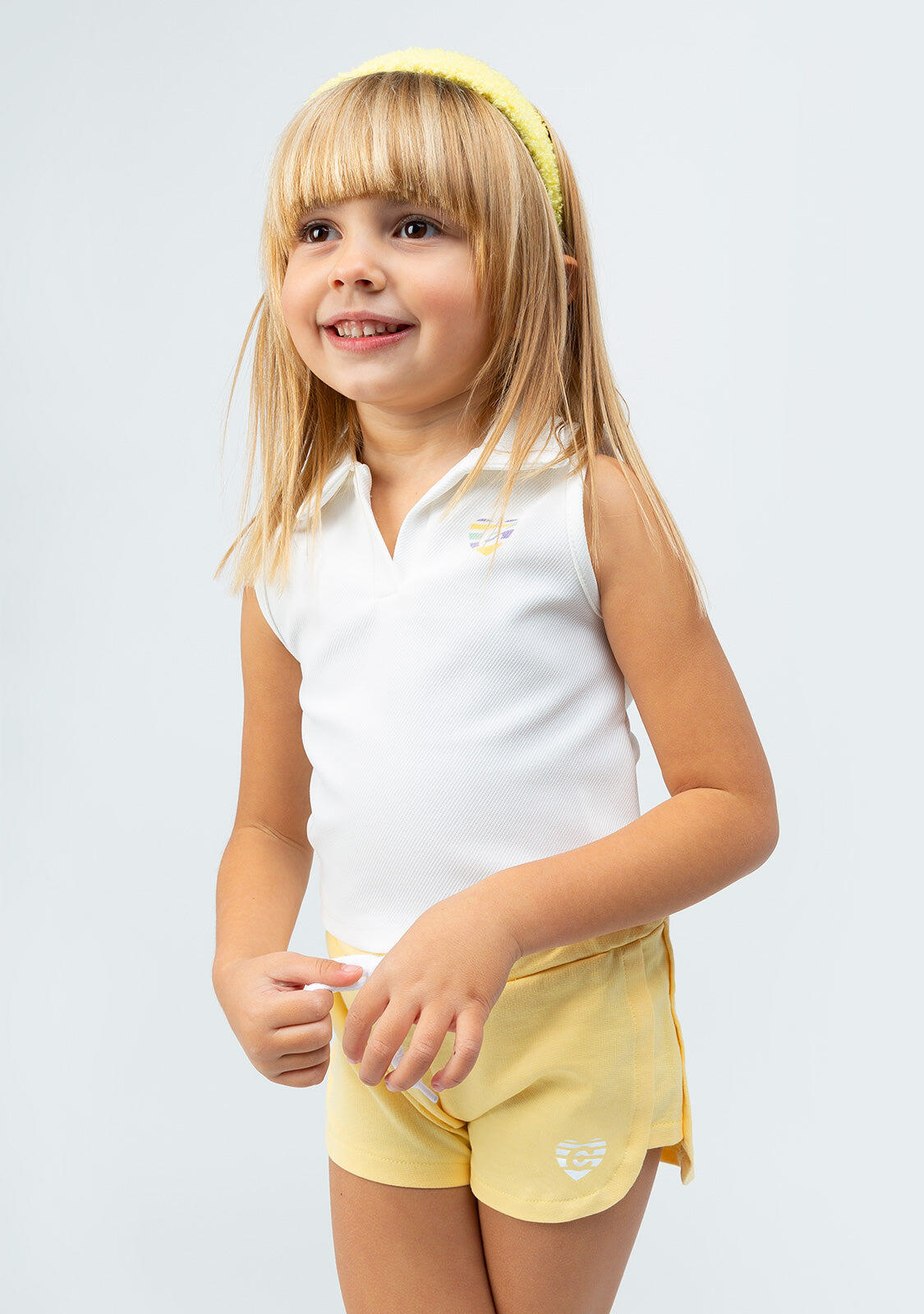 Polo blanco sin mangas de niña 2/4