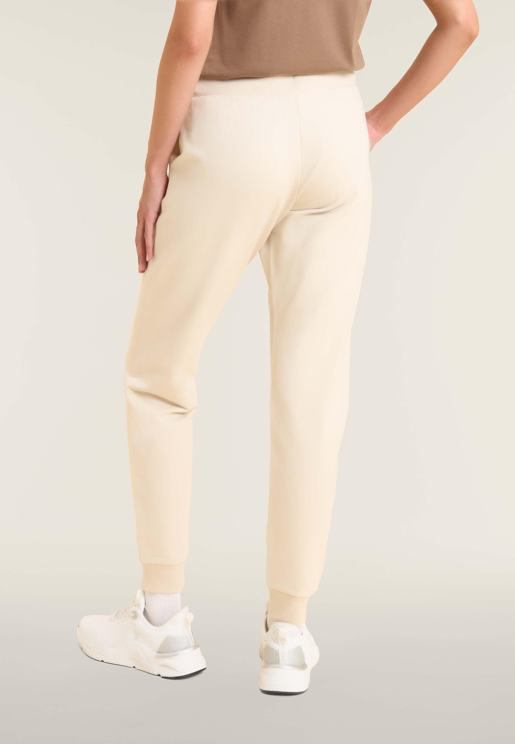 Pantalon de sport caractérisé par un bord avec bandes aux chevilles et cordon 3/5