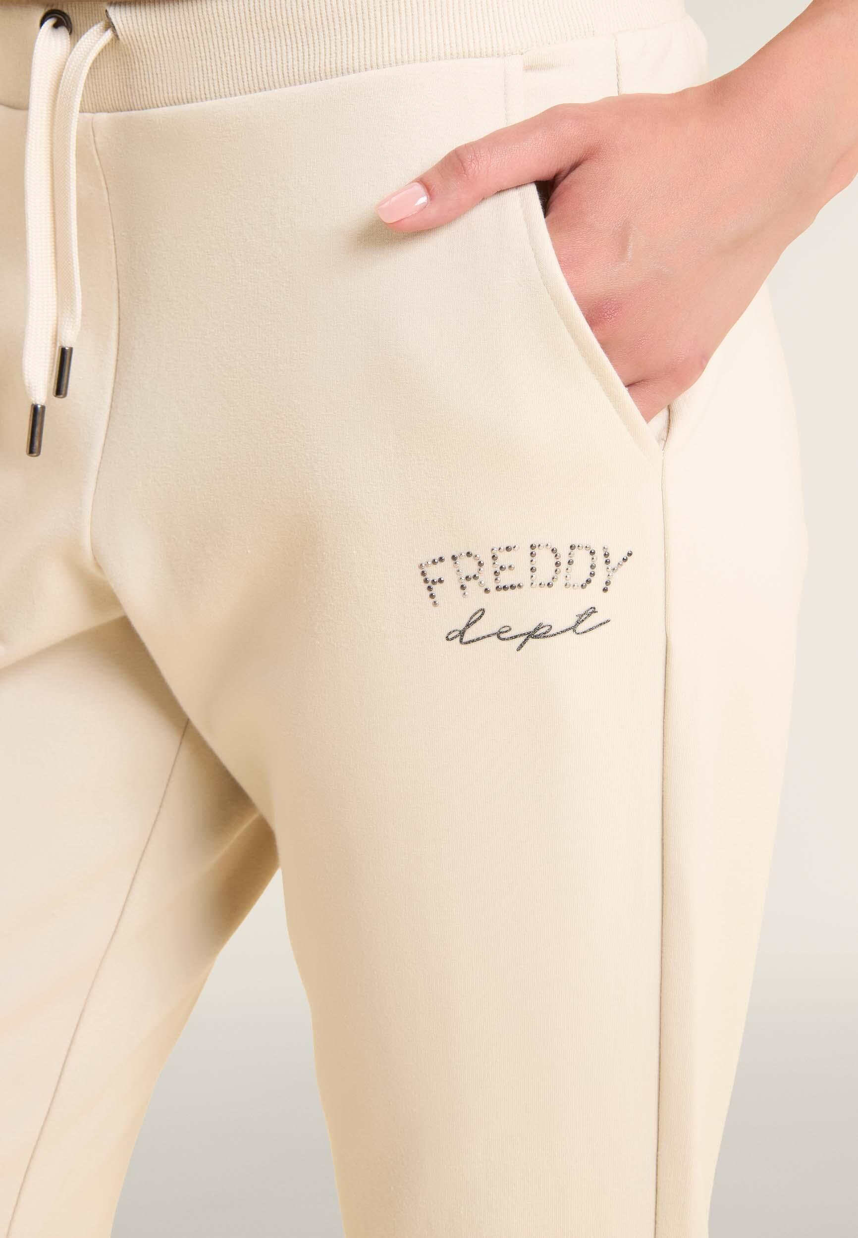 Pantalon de sport caractérisé par un bord avec bandes aux chevilles et cordon 4/5