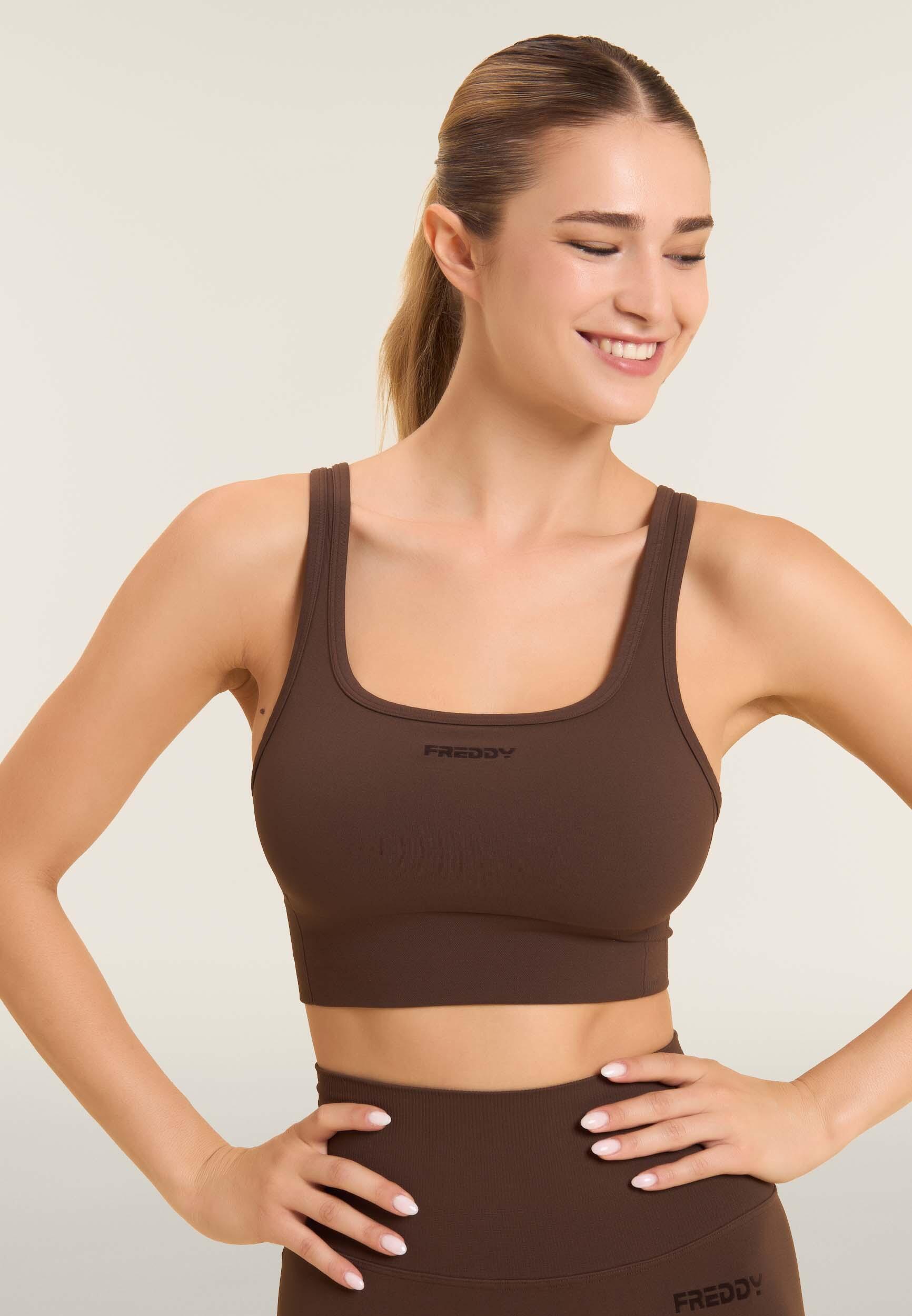 Top sportivo seamless supporto medio con inserti a costine 4/6