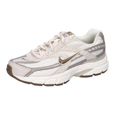 Scarpe da ginnastica da donna Nike Initiator color beige.