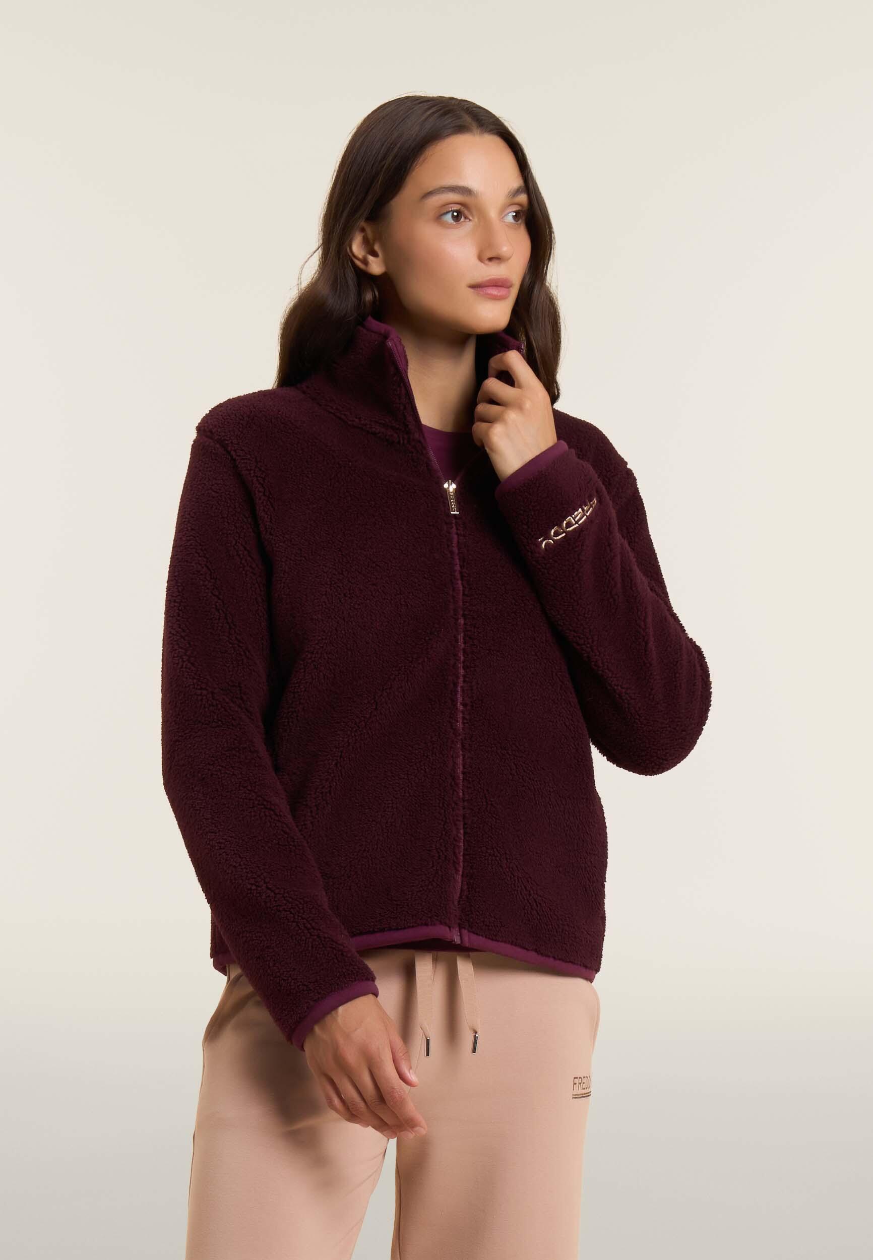 Giacca da donna in pile sherpa con collo alto e zip 2/4