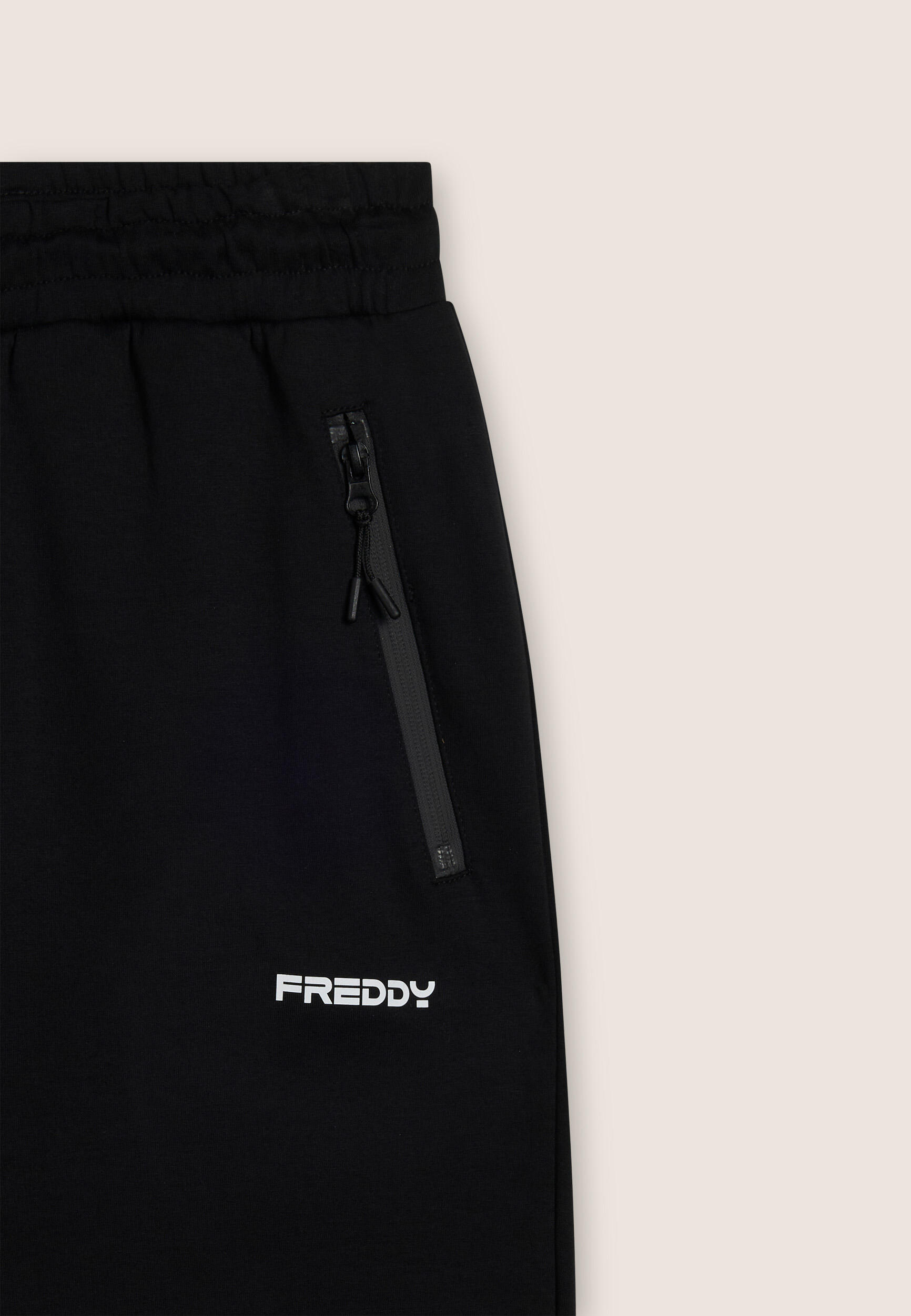 Pantaloni a carota in interlock con zip laterali 3/3