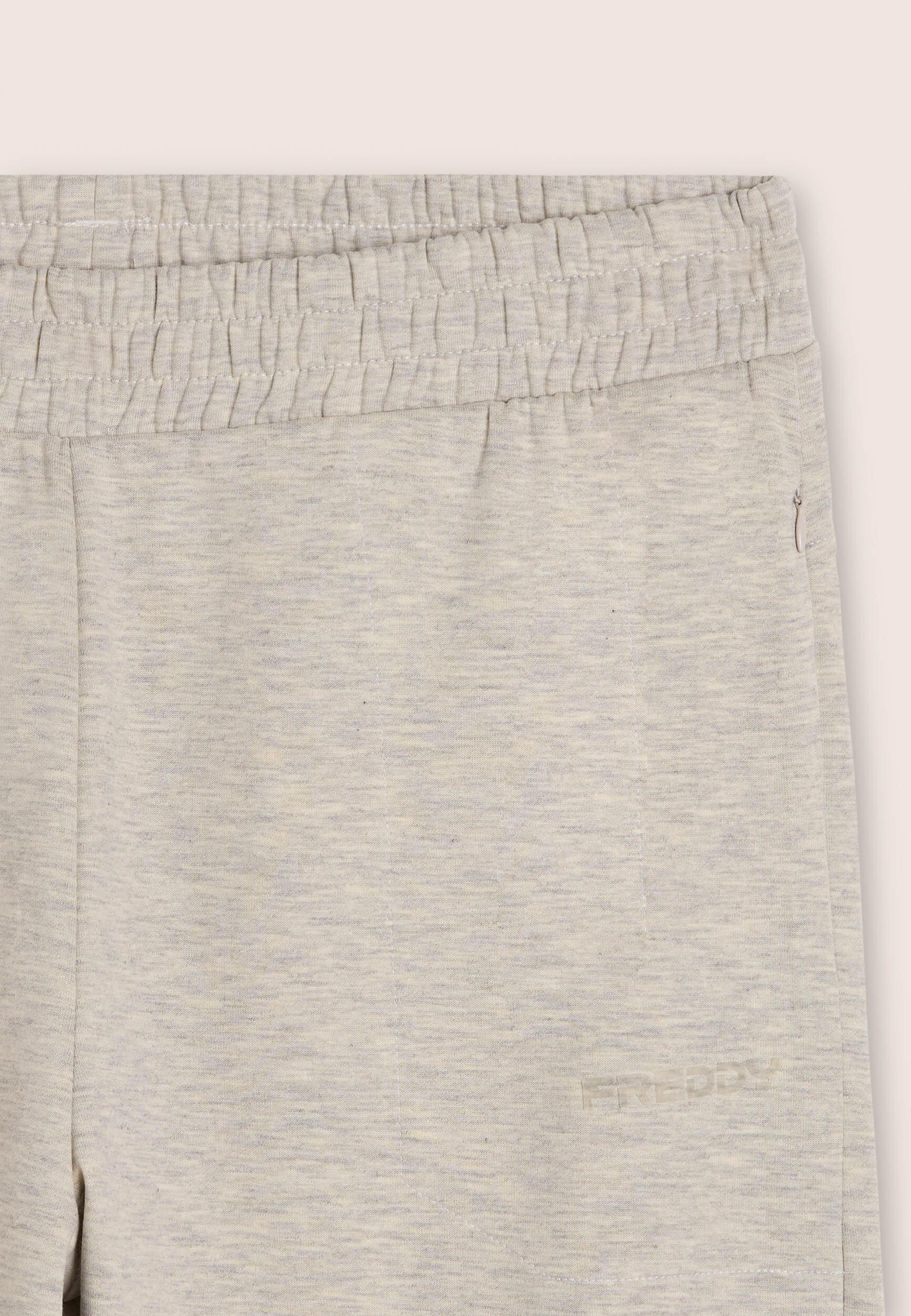 Pantalón slim jaspeado con estampado transparente y cremallera 3/3