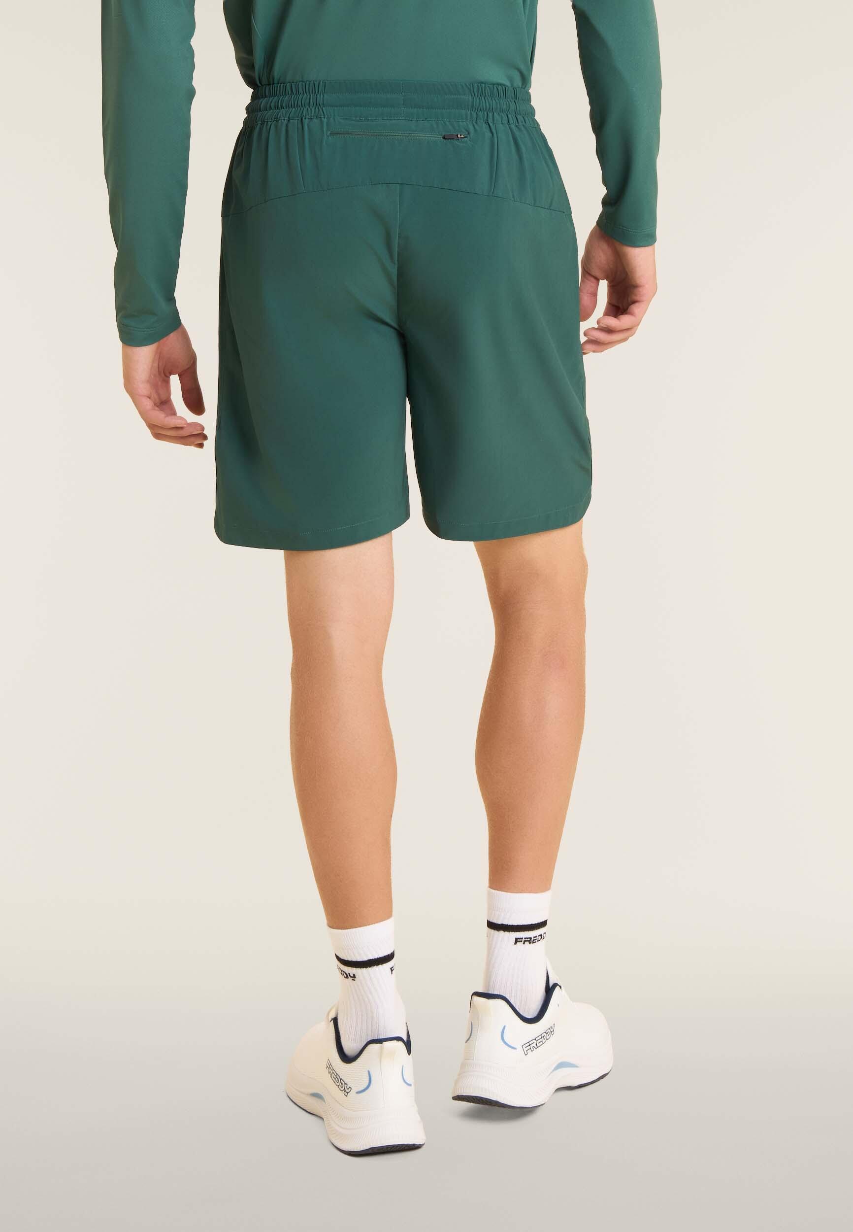 Pantalon court de coupe ajustée avec poches zippées et cordon à la taille 3/4