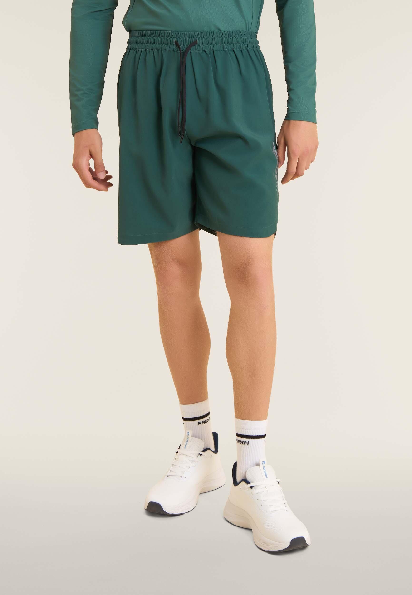 Pantalon court de coupe ajustée avec poches zippées et cordon à la taille 2/4