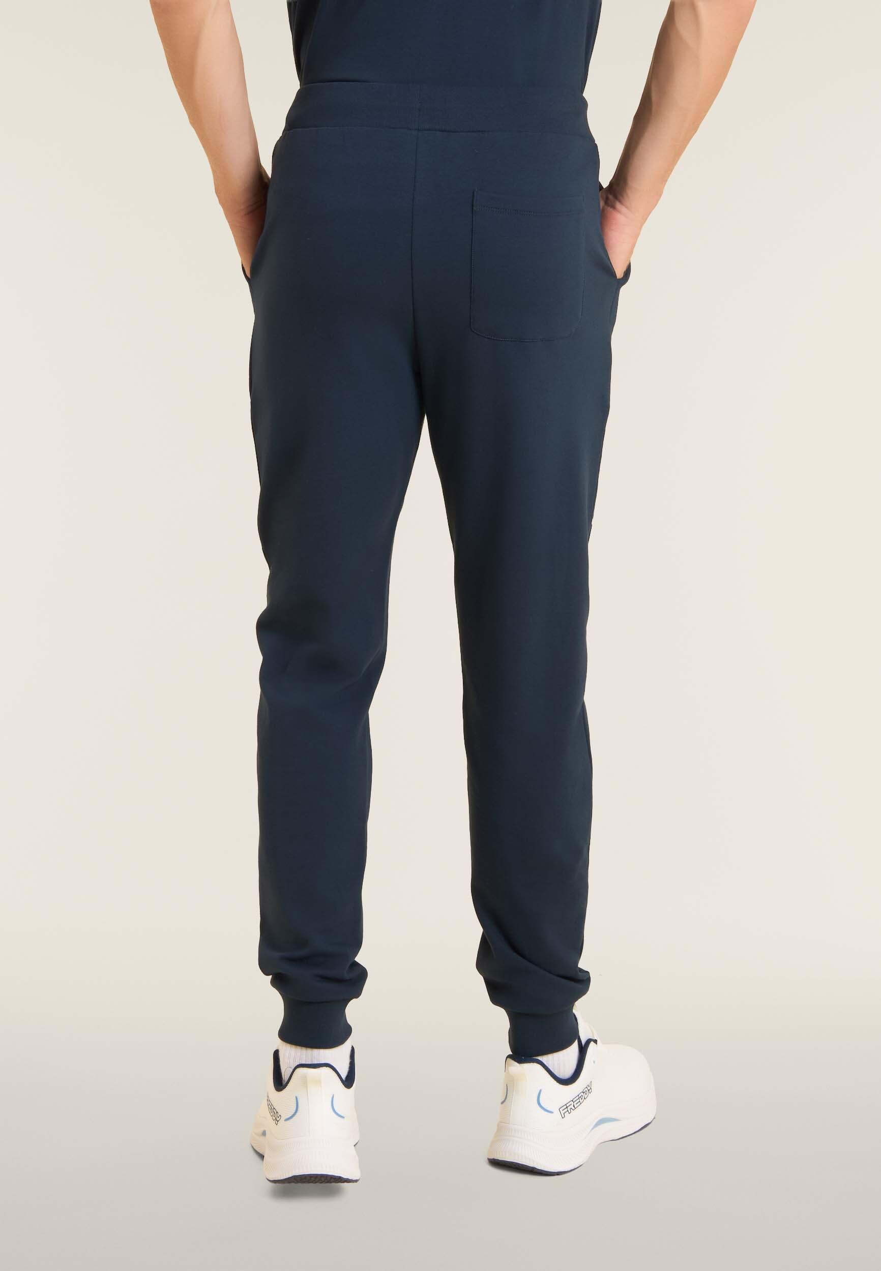 Pantalón slim en tejido interlock con maxilogotipo en relieve 3/4
