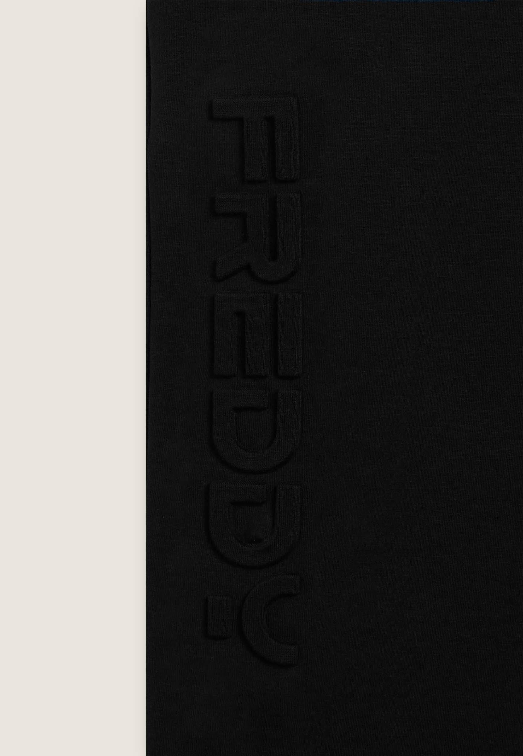 Pantaloni slim in interlock con maxi logo in rilievo 3/3