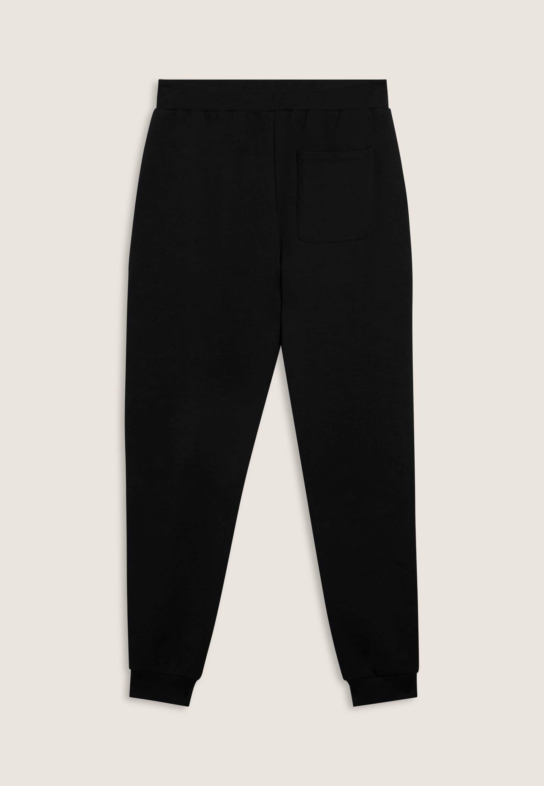 Pantaloni slim in interlock con maxi logo in rilievo 2/3