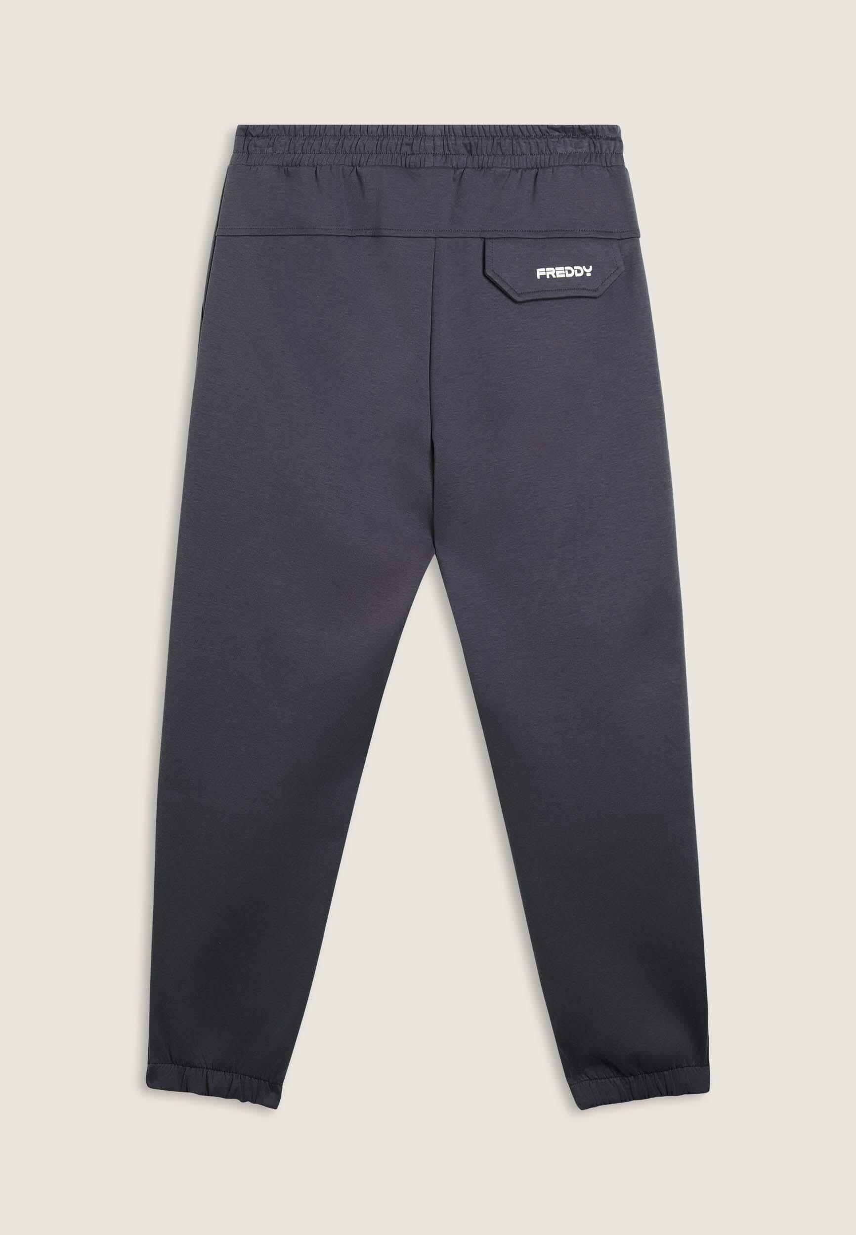 Pantalón slim fit en tejido interlock con estampado UT y costuras 2/4