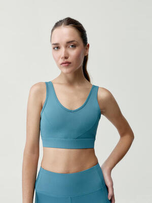 Top sportivo da donna Devi Sostegno Medio Performance