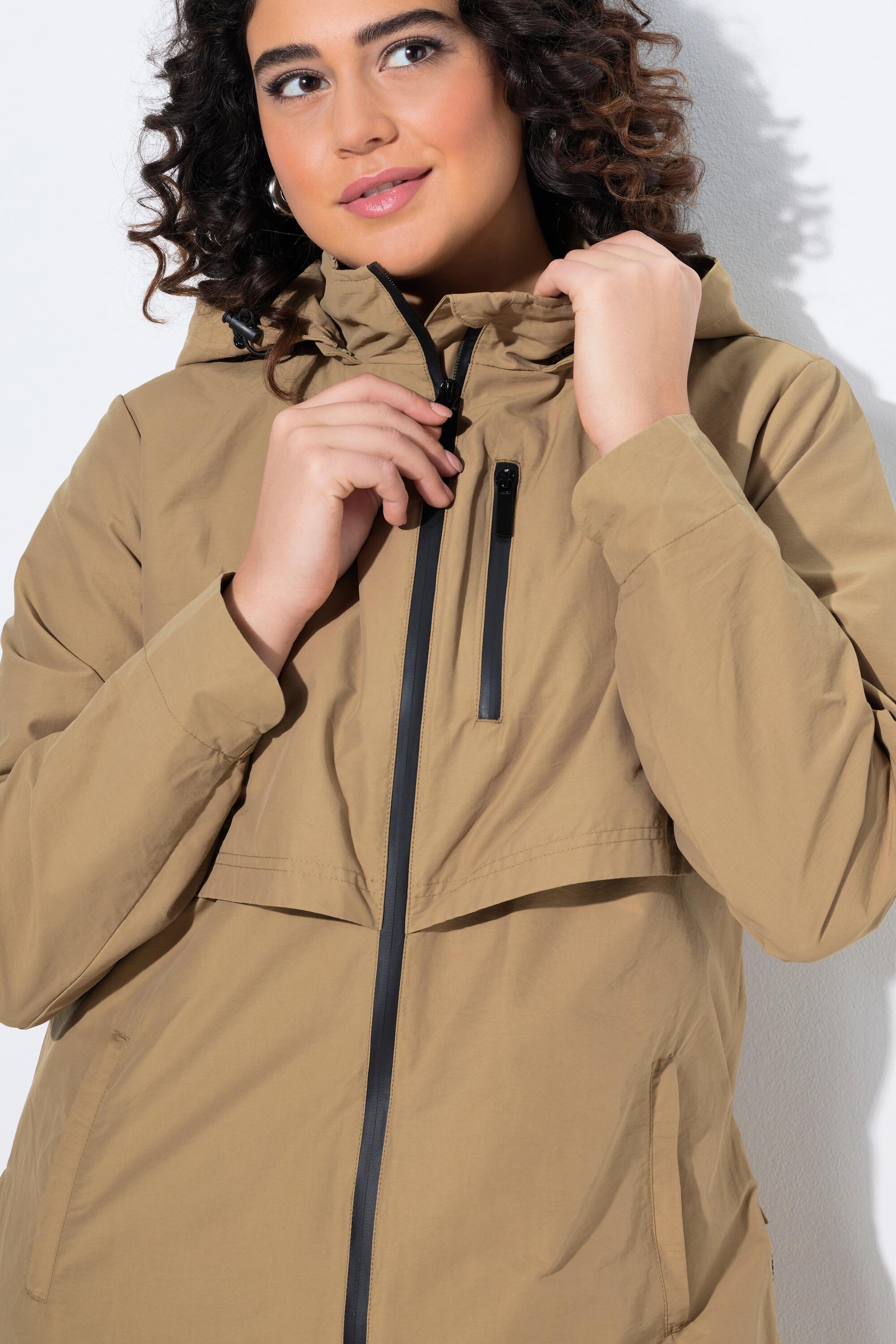 Femme Parka à capuche. Fentes latérales zippées. Poches zippées 3/7