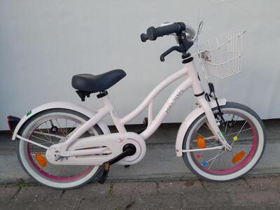 16 inch alpina ocean met terugtraprem en een mandje.