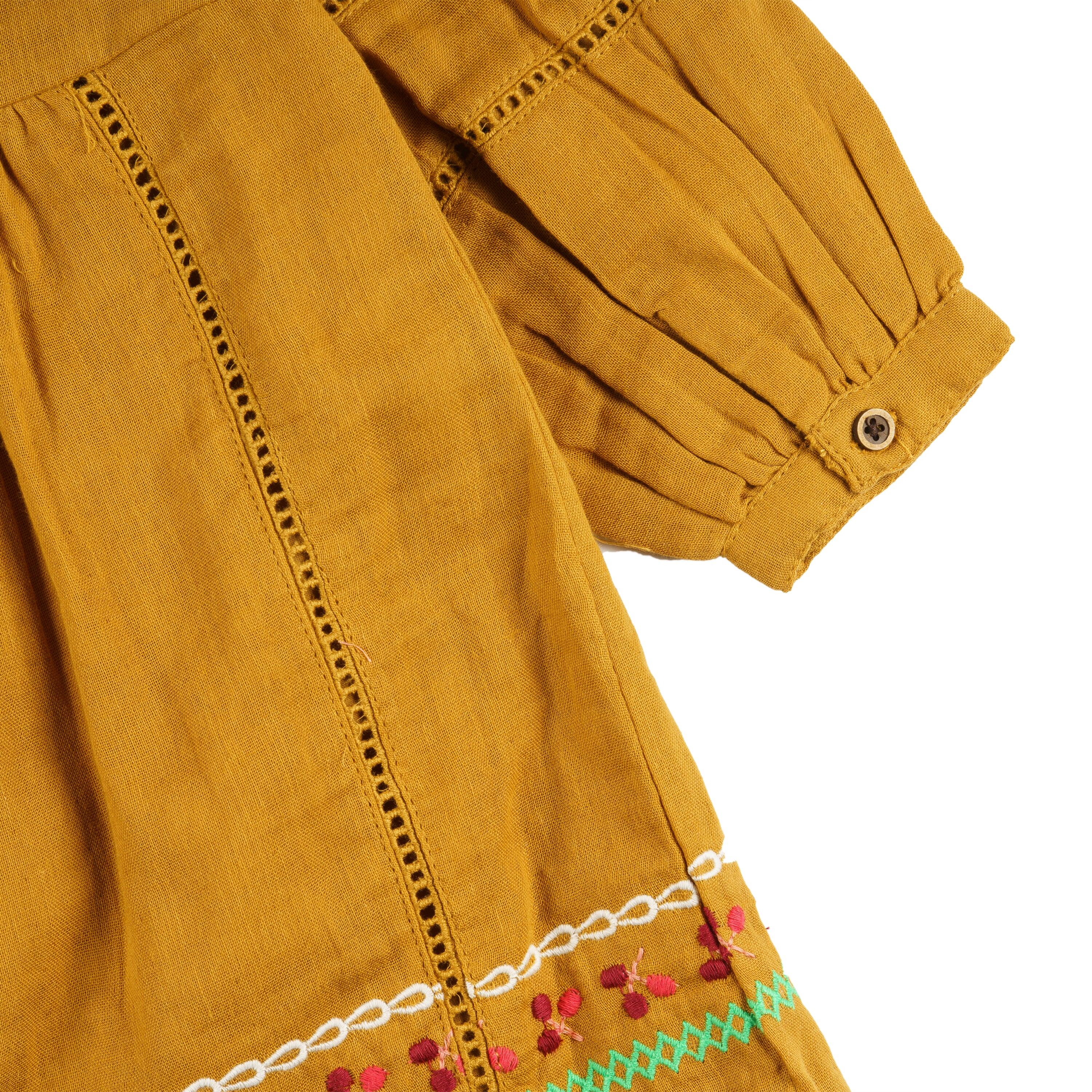 Vestido niña mostaza bambula bordado con borlas 4/4