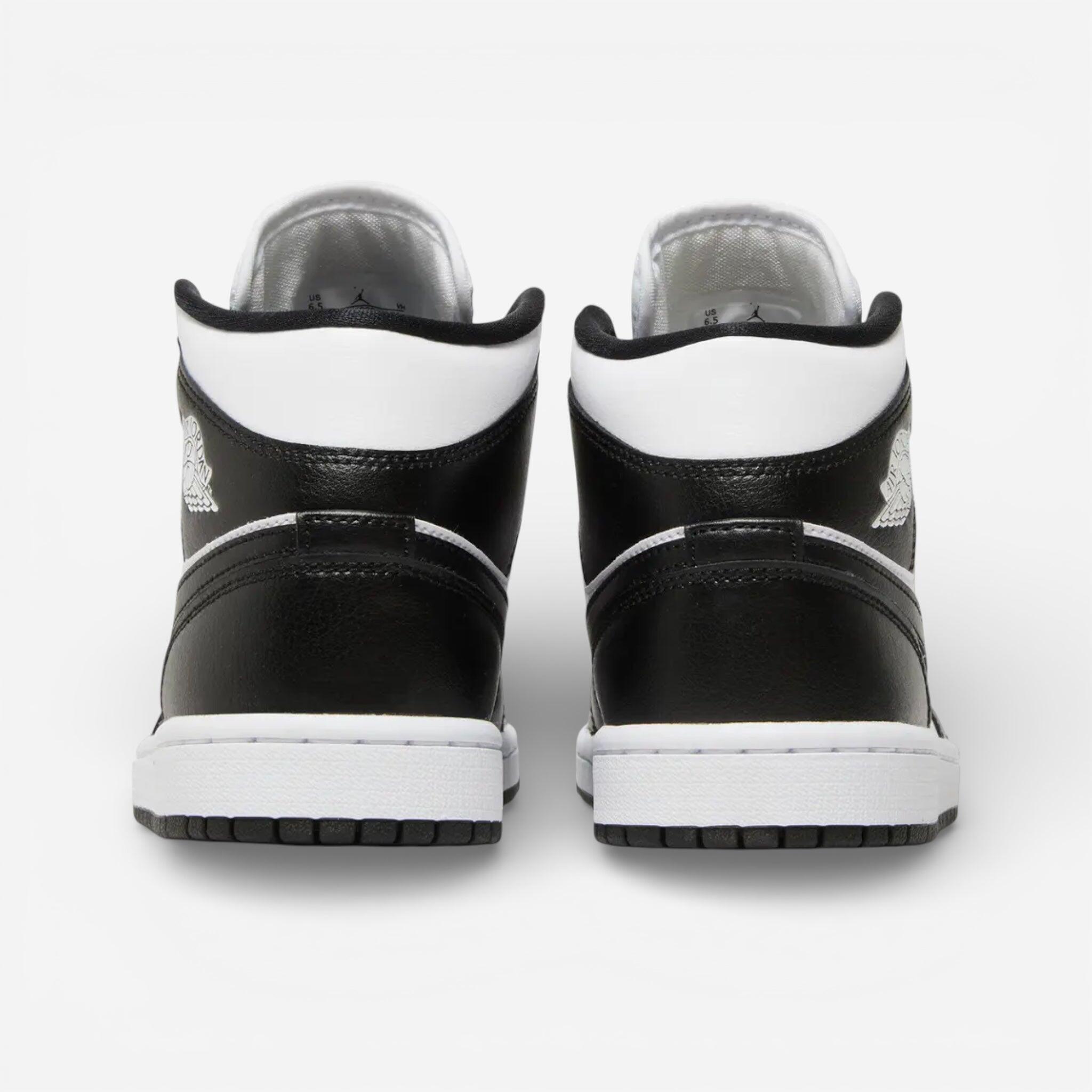 white and black jordan's 1